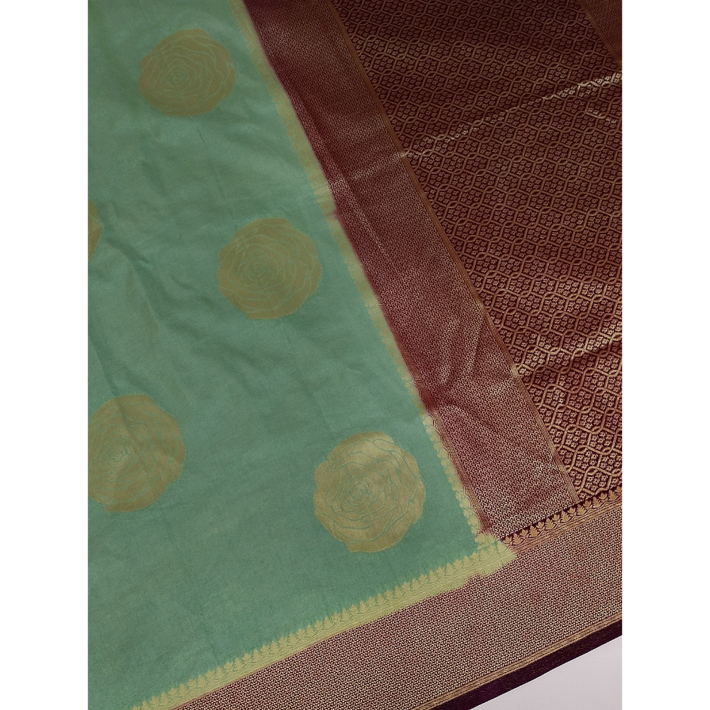 Pista geeen with Magentha border pearl viscose saree with floral motifs